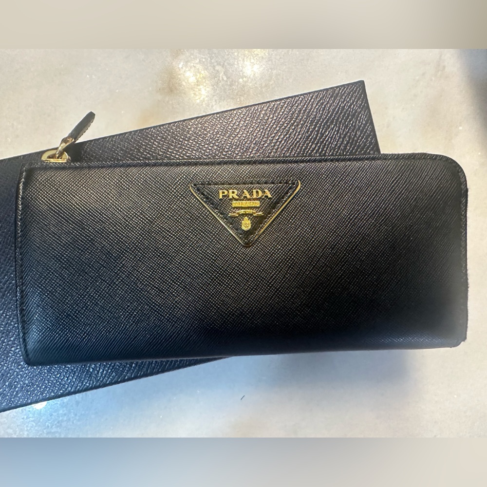 Prada Saffiano leather zip wallet. New w/ box and authenticity card. Never worn